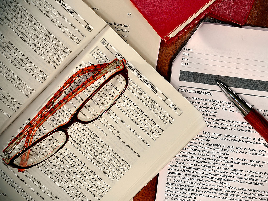 Glasses sitting on reference books